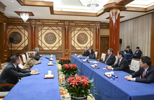 (251210) -- BEIJING, Dec. 10, 2025 (Xinhua) -- Chinese Vice Premier He Lifeng, also a member of the Political Bureau of the Communist Party of China Central Committee, meets with Director-General of the World Trade Organization (WTO) Ngozi Okonjo-Iweala in Beijing, capital of China, Dec. 9, 2025. (Xinhua/Zhang Ling)