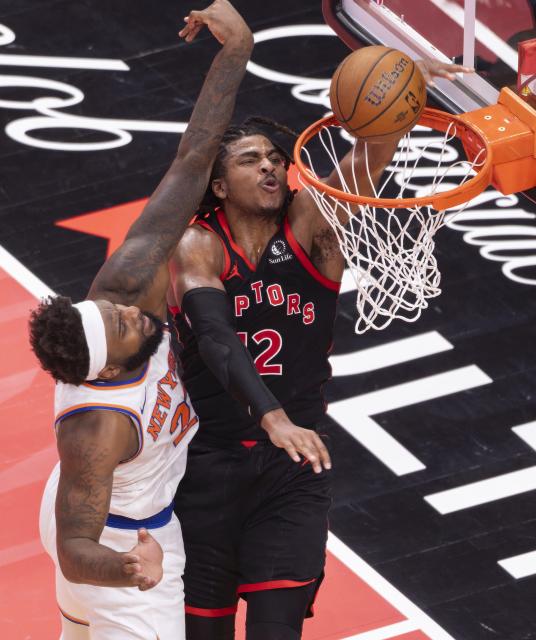 (251210) -- TORONTO, Dec. 10, 2025 (Xinhua) -- Collin Murray-Boyles (R) of Toronto Raptors dunks during the 2025-2026 NBA Cup quarterfinal match between Toronto Raptors and New York Knicks in Toronto, Canada, on Dec. 9, 2025. (Photo by Zou Zheng/Xinhua)