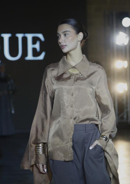 (251210) -- BAKU, Dec. 10, 2025 (Xinhua) -- A model walks the runway at the Azerbaijan international fashion week in Baku, Azerbaijan, on Dec. 9, 2025. The two-day international fashion week concluded here on Tuesday. (Xinhua/Chen Junfeng)