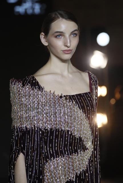 (251210) -- BAKU, Dec. 10, 2025 (Xinhua) -- A model walks the runway at the Azerbaijan international fashion week in Baku, Azerbaijan, on Dec. 9, 2025. The two-day international fashion week concluded here on Tuesday. (Xinhua/Chen Junfeng)