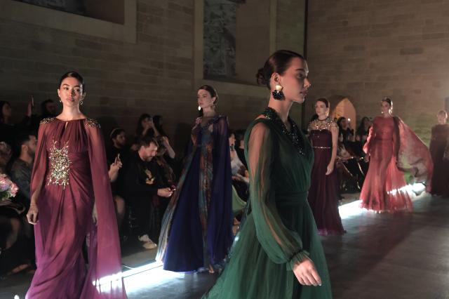 (251210) -- BAKU, Dec. 10, 2025 (Xinhua) -- Models walk the runway at the Azerbaijan international fashion week in Baku, Azerbaijan, on Dec. 9, 2025. The two-day international fashion week concluded here on Tuesday. (Xinhua/Chen Junfeng)