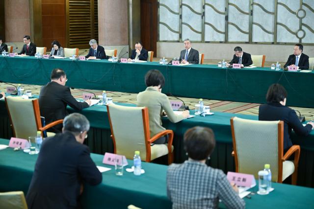 (251210) -- BEIJING, Dec. 10, 2025 (Xinhua) -- Chinese Foreign Minister Wang Yi, also a member of the Political Bureau of the Communist Party of China Central Committee, addresses a symposium on the study and research of Xi Jinping Thought on Diplomacy held in Beijing, capital of China, Dec. 9, 2025. (Xinhua/Dai Tianfang)