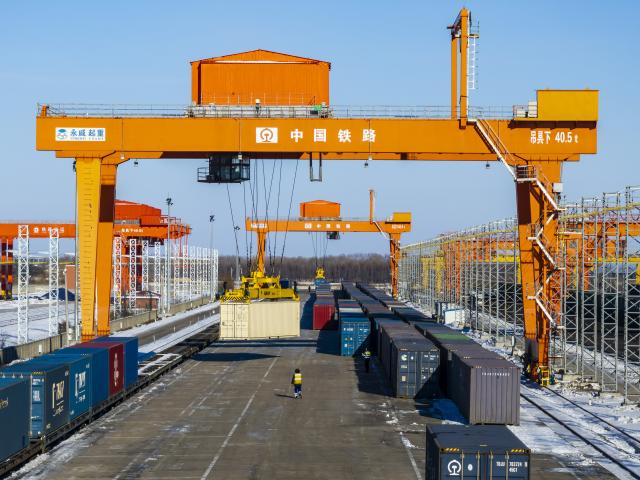 (251210) -- HARBIN, Dec. 10, 2025 (Xinhua) -- A drone photo taken on Dec. 8, 2025 shows cranes working at the transshipment yard of Tongjiang north railway station in Tongjiang, northeast China's Heilongjiang Province.
  As a China-Europe freight train composed of 60 carriages and loaded with home appliances and digital products departed from the Manzhouli railway port in north China's Inner Mongolia Autonomous Region, the "eastern corridor" of the China-Europe freight train network this year has witnessed 5,166 trains operating on its railway lines. 
   The "eastern corridor" consists of three railway ports including Manzhouli, Suifenhe and Tongjiang. Currently, the categories of goods transported by the trains have increased to more than 1,000 types. The number of operating routes has expanded to 27, linking over 60 Chinese cities with 14 European countries. (Photo by Wu Yunan/Xinhua)