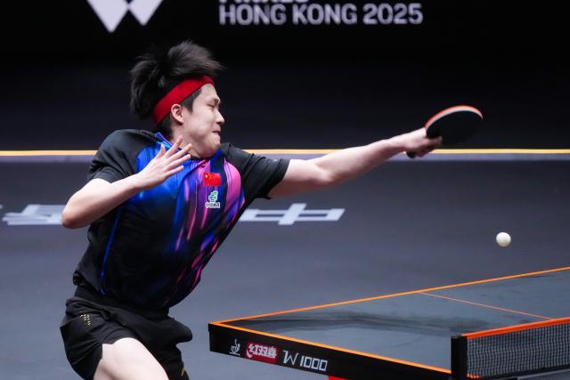 (251210) -- HONG KONG, Dec. 10, 2025 (Xinhua) -- Wang Chuqin hits a return during the men's singles round of 16 match between Wang Chuqin of China and Matsushima Sora of Japan at the WTT Finals Hong Kong 2025 in Hong Kong, south China, Dec. 10, 2025. (Xinhua/Zhu Wei)