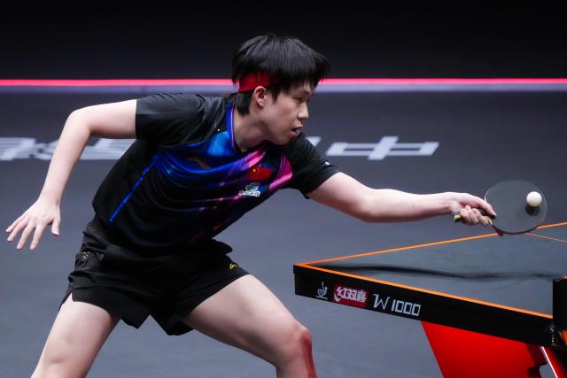 (251210) -- HONG KONG, Dec. 10, 2025 (Xinhua) -- Wang Chuqin hits a return during the men's singles round of 16 match between Wang Chuqin of China and Matsushima Sora of Japan at the WTT Finals Hong Kong 2025 in Hong Kong, south China, Dec. 10, 2025. (Xinhua/Zhu Wei)