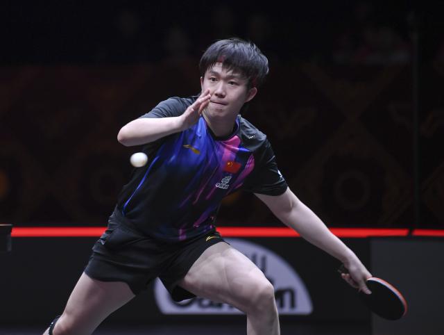 (251210) -- HONG KONG, Dec. 10, 2025 (Xinhua) -- Wang Chuqin hits a return during the men's singles round of 16 match between Wang Chuqin of China and Matsushima Sora of Japan at the WTT Finals Hong Kong 2025 in Hong Kong, south China, Dec. 10, 2025. (Xinhua/Chen Duo)