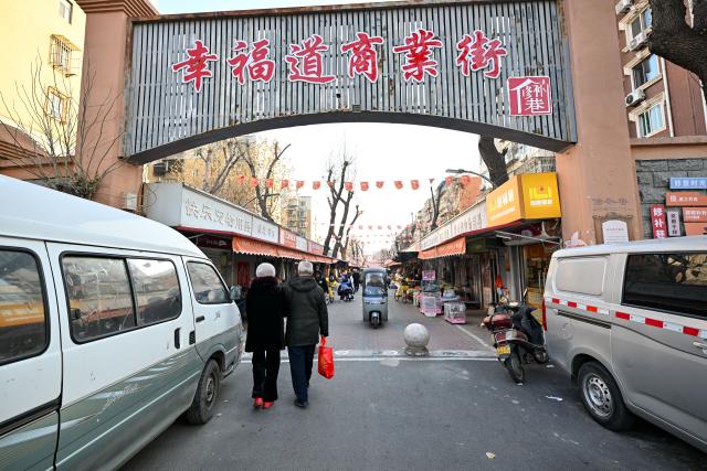 (251210) -- TIANJIN, Dec. 10, 2025 (Xinhua) -- This photo taken on Dec. 9, 2025 shows a view of the "repair alley" in north China's Tianjin. A "repair alley" established in June 2024 has become a lively hub for neighborhood-friendly repair services in Tianjin. In this dedicated zone, local residents have easy access to daily services such as knife sharpening, darning, locksmiths and watch repair. (Xinhua/Zhang Cheng)
