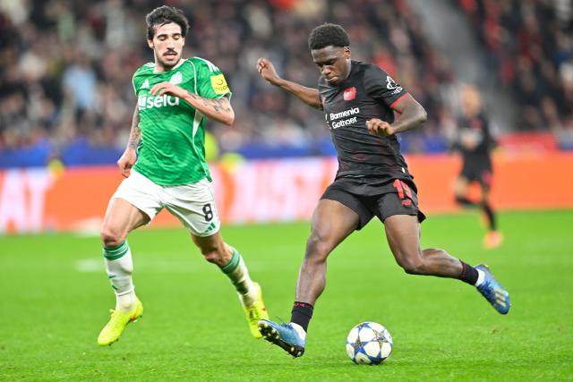 (251211) -- LEVERKUSEN, Dec. 11, 2025 (Xinhua) -- Ernest Poku (R) of Bayer 04 Leverkusen vies with Sandro Tonali of Newcastle United during the UEFA Champions League football match between Bayer 04 Leverkusen and Newcastle United in Leverkusen, Germany,  Dec. 10, 2025. (Photo by Ulrich Hufnagel/Xinhua)