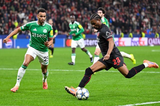 (251211) -- LEVERKUSEN, Dec. 11, 2025 (Xinhua) -- Nathan Tella (1st R) of Bayer 04 Leverkusen shoots during the UEFA Champions League football match between Bayer 04 Leverkusen and Newcastle United in Leverkusen, Germany,  Dec. 10, 2025. (Photo by Ulrich Hufnagel/Xinhua)