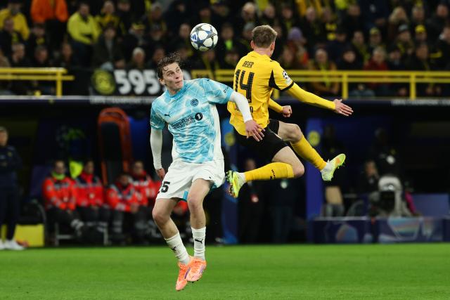 (251211) -- DORTMUND, Dec. 11, 2025 (Xinhua) -- Maximilian Beier (R) of Borussia Dortmund and Isak Dybvik Maatta of Bodo/Glimt head for the ball during the UEFA Champions League football match between Borussia Dortmund and Bodo/Glimt in Dortmund, Germany, Dec. 10, 2025. (Photo by Joachim Bywaletz/Xinhua)