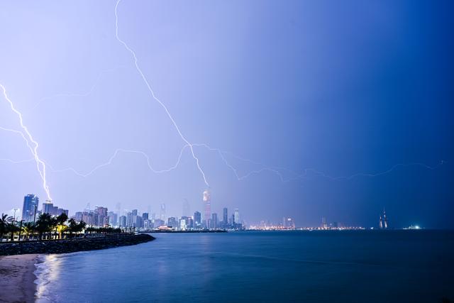 (251211) -- BEIJING, Dec. 11, 2025 (Xinhua) -- This photo taken on Dec. 10, 2025 shows the lightning over the skyline of Kuwait City, Kuwait. (Photo by Asad/Xinhua)