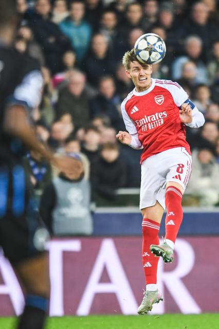 (251211) -- BRUGES, Dec. 11, 2025 (Xinhua) -- Martin Odegaard of Arsenal heads for the ball during the UEFA Champions League football match between Club Brugge and Arsenal in Bruges, Belgium, on Dec. 10, 2025. (Xinhua/Peng Ziyang)