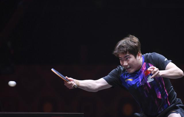 (251211) -- HONG KONG, Dec. 11, 2025 (Xinhua) -- Liang Jingkun hits a return during the men's singles round of 16 match between Liang Jingkun of China and Lin Shidong of China at the WTT Finals Hong Kong 2025 in Hong Kong, south China, Dec. 11, 2025. (Xinhua/Chen Duo)