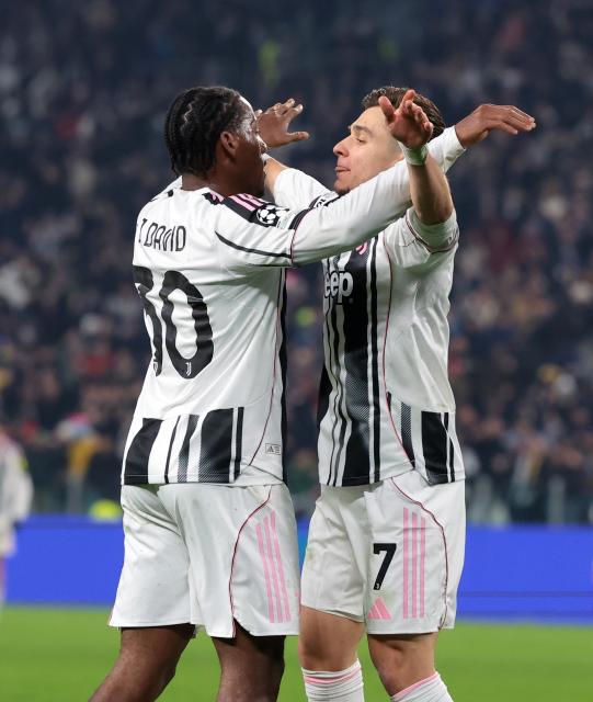 (251211) -- TURIN, Dec. 11, 2025 (Xinhua) -- Juventus' Jonathan David (L) celebrates a goal with his teammate Francisco Coincencao during the UEFA Champions League match between Juventus and Pafos in Turin, Italy, Dec. 10, 2025. (Photo by Alberto Lingria/Xinhua)