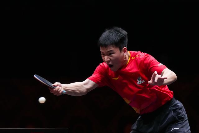(251211) -- HONG KONG, Dec. 11, 2025 (Xinhua) -- Xiang Peng hits a return during the men's singles round of 16 match between An Jaehyun of South Korea and Xiang Peng of China at the WTT Finals Hong Kong 2025 in Hong Kong, south China, Dec. 11, 2025. (Xinhua/Zhu Wei)