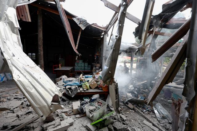 (251211) -- SURIN PROVINCE, Dec. 11, 2025 (Xinhua) -- A house damaged by artillery is seen in Surin province, Thailand, Dec. 11, 2025. Thai Defense Ministry spokesperson Surasant Kongsiri said on Thursday that the ongoing border clashes with Cambodia have left nine Thai soldiers dead and more than 120 people injured. (Xinhua)