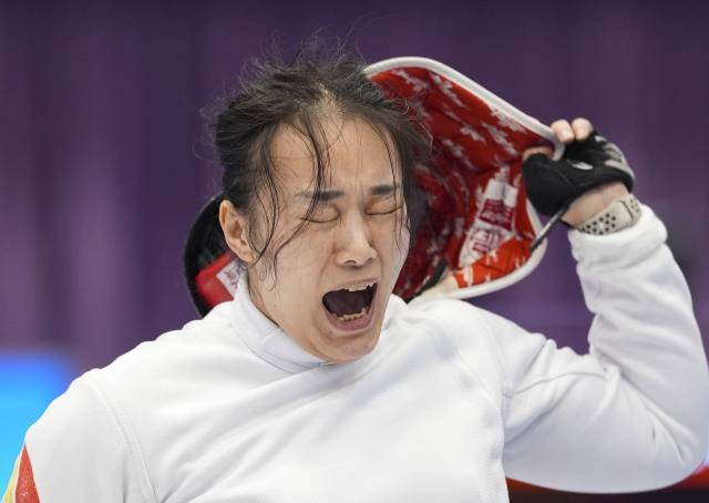 (251211) -- HONG KONG, Dec. 11, 2025 (Xinhua) -- Ao Lanzhu of Shanghai celebrates after winning the women's epee individual category B semifinals of wheelchair fencing at China's 12th National Games for Persons with Disabilities and the 9th National Special Olympic Games in Hong Kong, south China, Dec. 11, 2025. (Xinhua/Hou Jun)