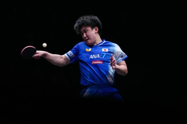 (251211) -- HONG KONG, Dec. 11, 2025 (Xinhua) -- Harimoto Tomokazu hits a return during the men's singles round of 16 match between Simon Gauzy of France and Harimoto Tomokazu of Japan at the WTT Finals Hong Kong 2025 in Hong Kong, south China, Dec. 11, 2025. (Xinhua/Zhu Wei)