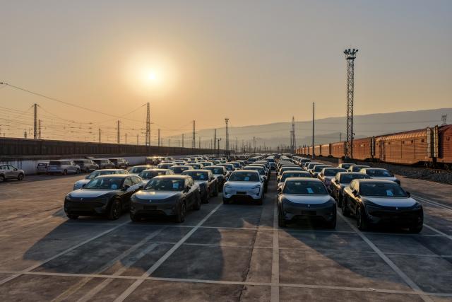 (251211) -- CHONGQING, Dec. 11, 2025 (Xinhua) -- A drone photo taken on Nov. 29, 2025 shows export-bound new energy vehicles made in Chongqing waiting to be loaded onto a cargo train at a commercial vehicle logistics base in Chongqing, southwest China. In recent years, as Chongqing accelerated its transformation into an inland hub for opening-up, a growing number of locally manufactured vehicles have found their way to overseas markets. The local automotive industry encompasses a wide range of power solutions such as battery electric, plug-in hybrid, extended-range, hydrogen fuel cell and battery-swapping technologies. Evolving industrial chain, product quality and supply mechanisms have all contributed to Chongqing's growing vehicle exports. 
  According to the Chongqing Customs, in the first ten months of 2025, the export value of Chongqing-manufactured vehicles increased 13.6 percent year on year, reaching 40.22 billion yuan (about 5.70 billion U.S. dollars), with the export value of electric vehicles growing 72.1 percent year on year to reach 11.65 billion yuan (about 1.65 billion U.S. dollars). (Xinhua/Huang Wei)