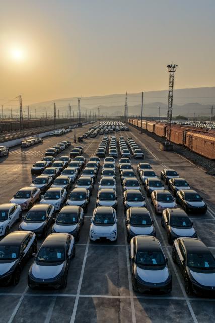 (251211) -- CHONGQING, Dec. 11, 2025 (Xinhua) -- A drone photo taken on Nov. 29, 2025 shows export-bound new energy vehicles waiting to be loaded onto a cargo train at a commercial vehicle logistics base in Chongqing, southwest China. In recent years, as Chongqing accelerated its transformation into an inland hub for opening-up, a growing number of locally manufactured vehicles have found their way to overseas markets. The local automotive industry encompasses a wide range of power solutions such as battery electric, plug-in hybrid, extended-range, hydrogen fuel cell and battery-swapping technologies. Evolving industrial chain, product quality and supply mechanisms have all contributed to Chongqing's growing vehicle exports. 
  According to the Chongqing Customs, in the first ten months of 2025, the export value of Chongqing-manufactured vehicles increased 13.6 percent year on year, reaching 40.22 billion yuan (about 5.70 billion U.S. dollars), with the export value of electric vehicles growing 72.1 percent year on year to reach 11.65 billion yuan (about 1.65 billion U.S. dollars). (Xinhua/Huang Wei)