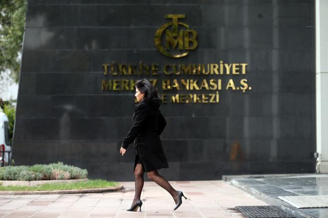 (251211) -- ANKARA, Dec. 11, 2025 (Xinhua) -- A woman walks past Türkiye's central bank in Ankara, Türkiye, Dec. 11, 2025. Türkiye's central bank cut its benchmark one-week repo rate by 150 basis points to 38 percent on Thursday, the bank's Monetary Policy Committee (MPC) said. (Mustafa Kaya/Handout via Xinhua)