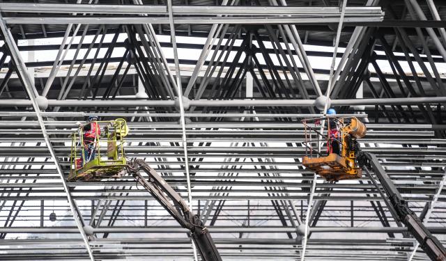 (251211) -- LIUPANSHUI, Dec. 11, 2025 (Xinhua) -- Workers are pictured at a construction site of the Liupanshui Railway Station building and yard renovation project in Liupanshui City, southwest China's Guizhou Province, on Dec. 11, 2025. The renovation project of the station building and yard of Liupanshui Railway Station on the Anshun-Liupanshui High-Speed Railway is advancing steadily at present. (Xinhua/Tao Liang)