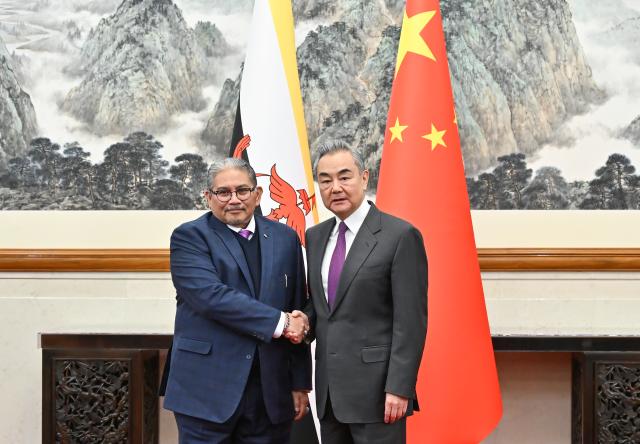 (251211) -- BEIJING, Dec. 11, 2025 (Xinhua) -- Chinese Foreign Minister Wang Yi, also a member of the Political Bureau of the Communist Party of China Central Committee, holds talks with Dato Erywan Pehin Yusof, Brunei's second minister of foreign affairs, in Beijing, capital of China, Dec. 11, 2025. (Xinhua/Li Xin)