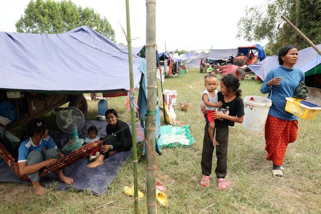 (251211) -- SIEM REAP, Dec. 11, 2025 (Xinhua) -- Cambodian evacuees stay under tents at a safe zone in Siem Reap province, Cambodia, on Dec. 11, 2025. At least 10 Cambodian civilians have been killed and 60 others wounded in the latest round of border conflict with Thailand, a Cambodian Defense Spokesperson said on Thursday. (Photo by Sovannara/Xinhua)