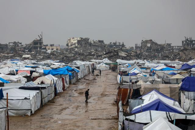 (251211) -- GAZA, Dec. 11, 2025 (Xinhua) -- Photo taken on Dec. 11, 2025 shows shelters of displaced Palestinians in the Zeitoun neighborhood, southeast of Gaza City. Heavy winter rains and high winds are pounding flimsy temporary shelters of tents and tarps in the Gaza Strip, putting more vulnerable people at risk, UN humanitarians said on Wednesday. (Photo by Rizek Abdeljawad/Xinhua)