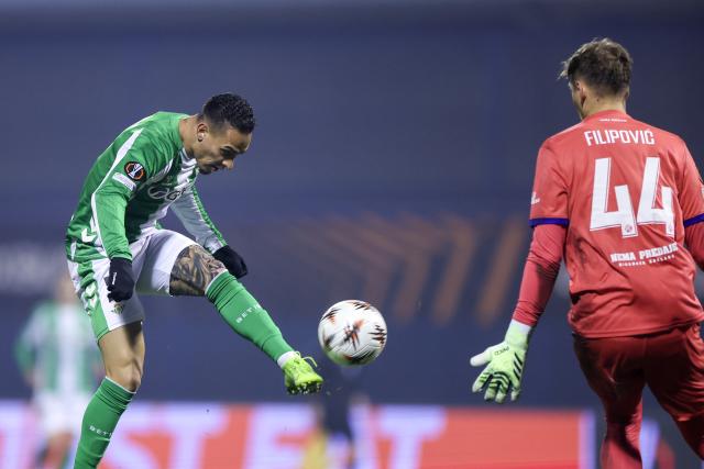 (251212) -- ZAGREB, Dec. 12, 2025 (Xinhua) -- Antony Santos (L) of Real Betis shoots and scores during the UEFA Europa League 2025/26 League Phase match between GNK Dinamo and Real Betis in Zagreb, Croatia, on Dec. 11, 2025. (Sanjin Strukic/PIXSELL via Xinhua)