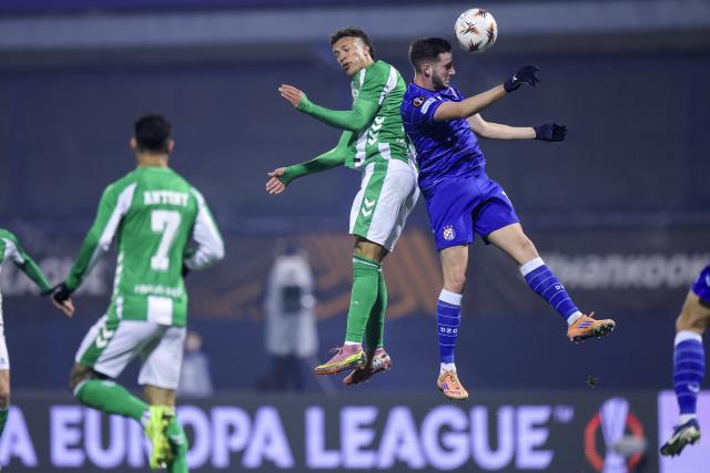 (251212) -- ZAGREB, Dec. 12, 2025 (Xinhua) -- Nelson Deossa (top L) of Real Betis and Marko Soldo of Dinamo compete for the ball during the UEFA Europa League 2025/26 League Phase match between GNK Dinamo and Real Betis in Zagreb, Croatia, on Dec. 11, 2025. (Sanjin Strukic/PIXSELL via Xinhua)