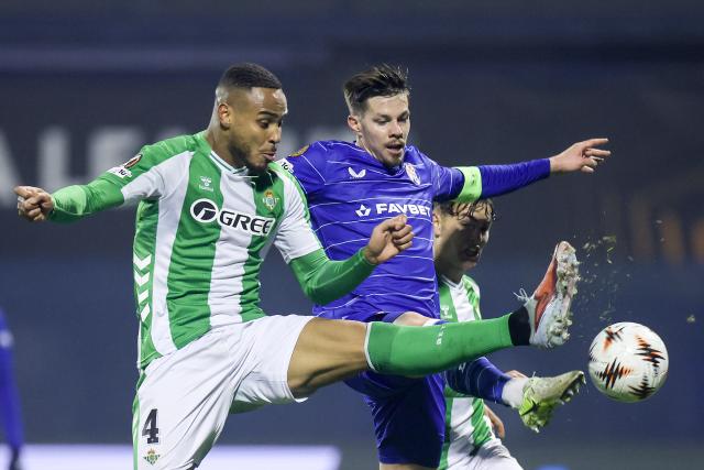 (251212) -- ZAGREB, Dec. 12, 2025 (Xinhua) -- Natan de Souza (L) of Real Betis and Miha Zajc of Dinamo compete for the ball during the UEFA Europa League 2025/26 League Phase match between GNK Dinamo and Real Betis in Zagreb, Croatia, on Dec. 11, 2025. (Sanjin Strukic/PIXSELL via Xinhua)