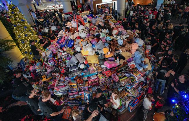 (251212) -- BEIJING, Dec. 12, 2025 (Xinhua) -- Donated toys are piled up during the Pan Pacific Christmas Wish Breakfast 2025 at Canada Place in Vancouver, British Columbia, Canada, on Dec. 10, 2025. As one of Canada's largest one-day toy drives, the annual Pan Pacific Christmas Wish Breakfast was held on Wednesday. The event collected more than 20 tonnes of toys, bringing joy to children and providing support to families in need. (Photo by Liang Sen/Xinhua)