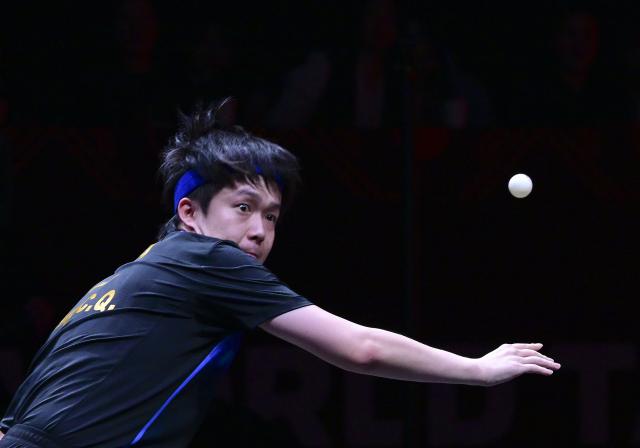 (251212) -- HONG KONG, Dec. 12, 2025 (Xinhua) -- Wang Chuqin of China hits a return during the men's singles quarterfinal match against Alexis Lebrun of France at the WTT Finals Hong Kong 2025 in Hong Kong, south China, Dec. 12, 2025. (Xinhua/Chen Duo)