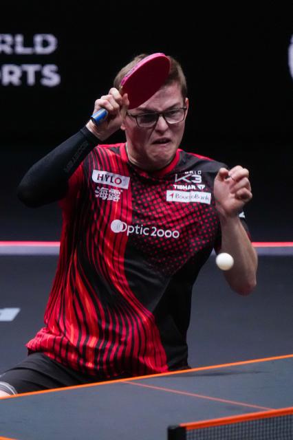 (251212) -- HONG KONG, Dec. 12, 2025 (Xinhua) -- Alexis Lebrun of France hits a return during the men's singles quarterfinal match against Wang Chuqin of China at the WTT Finals Hong Kong 2025 in Hong Kong, south China, Dec. 12, 2025. (Xinhua/Zhu Wei)