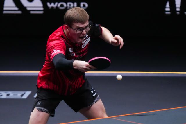 (251212) -- HONG KONG, Dec. 12, 2025 (Xinhua) -- Alexis Lebrun of France hits a return during the men's singles quarterfinal match against Wang Chuqin of China at the WTT Finals Hong Kong 2025 in Hong Kong, south China, Dec. 12, 2025. (Xinhua/Zhu Wei)