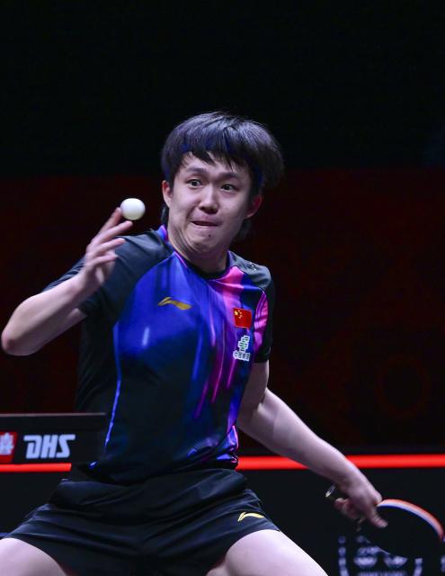 (251212) -- HONG KONG, Dec. 12, 2025 (Xinhua) -- Wang Chuqin of China hits a return during the men's singles quarterfinal match against Alexis Lebrun of France at the WTT Finals Hong Kong 2025 in Hong Kong, south China, Dec. 12, 2025. (Xinhua/Chen Duo)