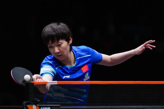(251212) -- HONG KONG, Dec. 12, 2025 (Xinhua) -- Wang Manyu of China hits a return during the women's singles quarterfinal match against Joo Cheonhui of South Korea at the WTT Finals Hong Kong 2025 in Hong Kong, south China, Dec. 12, 2025. (Xinhua/Zhu Wei)