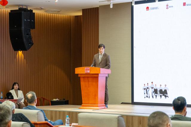 (251212) -- BELGRADE, Dec. 12, 2025 (Xinhua) -- Secretary of State for the Ministry of Culture of Serbia Lav Pajkic speaks during the opening ceremony of a photo exhibition marking the 70th anniversary of the first China tour by Serbia's National Ensemble "Kolo" at the Chinese Cultural Center in Belgrade, Serbia, Dec. 11, 2025. The exhibition, featuring photographs from Kolo's 1955 and 2025 China tours, opened here on Thursday. (Photo by Nemanja Cabric/Xinhua)