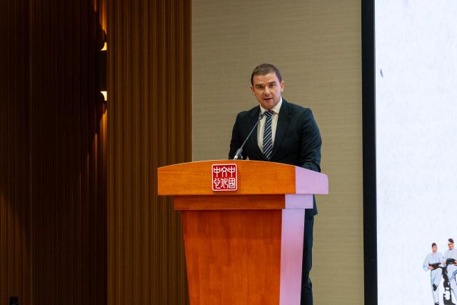 (251212) -- BELGRADE, Dec. 12, 2025 (Xinhua) -- Director of Serbia's National Ensemble "Kolo" Zdravko Ranisavljevic speaks during the opening ceremony of a photo exhibition marking the 70th anniversary of the first China tour by Kolo at the Chinese Cultural Center in Belgrade, Serbia, Dec. 11, 2025. The exhibition, featuring photographs from Kolo's 1955 and 2025 China tours, opened here on Thursday. (Photo by Nemanja Cabric/Xinhua)