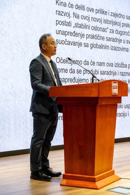 (251212) -- BELGRADE, Dec. 12, 2025 (Xinhua) -- Chinese Ambassador to Serbia Li Ming speaks during the opening ceremony of a photo exhibition marking the 70th anniversary of the first China tour by Serbia's National Ensemble "Kolo" at the Chinese Cultural Center in Belgrade, Serbia, Dec. 11, 2025. The exhibition, featuring photographs from Kolo's 1955 and 2025 China tours, opened here on Thursday. (Photo by Nemanja Cabric/Xinhua)