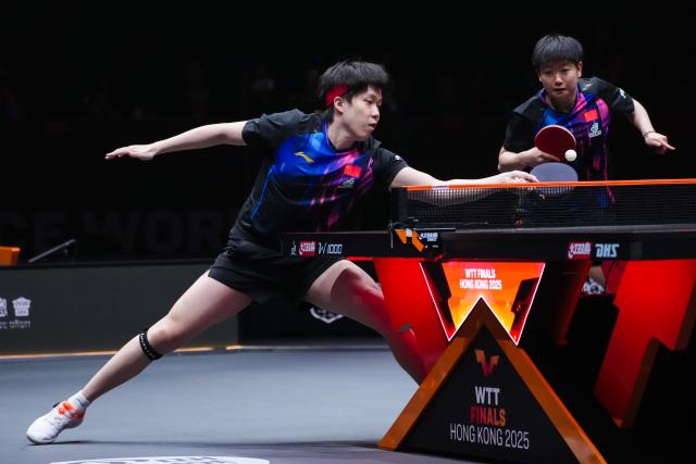 (251212) -- HONG KONG, Dec. 12, 2025 (Xinhua) -- Wang Chuqin (L)/Sun Yingsha compete during the mixed doubles group 1 match between Wang Chuqin/Sun Yingsha of China and Wong Chun Ting/Doo Hoi Kem of China's Hong Kong at the WTT Finals Hong Kong 2025 in Hong Kong, south China, Dec. 12, 2025. (Xinhua/Zhu Wei)