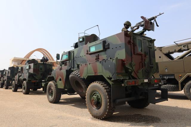 (251212) -- ACCRA, Dec. 12, 2025 (Xinhua) -- Armored vehicles are pictured during a joint exercise launched by Ghanaian security services in Accra, Ghana, Dec. 11, 2025. Ghanaian security services launched a joint exercise on Thursday to showcase their preparedness to maintain peace and security in the country.
  The "Show of Force" operation, involving the military, police, immigration, fire service, prisons, and the customs division of the Ghana Revenue Authority, deployed personnel, combat gear and hardware along major routes from the city of Accra to communities outside the capital to boost inter-agency cooperation and reinforce the country's security posture. (Photo by Seth/Xinhua)