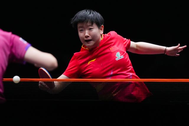 (251212) -- HONG KONG, Dec. 12, 2025 (Xinhua) -- Sun Yingsha hits a return during the women's singles quarterfinal match between Sun Yingsha of China and Nagasaki Miyu of Japan at the WTT Finals Hong Kong 2025 in Hong Kong, south China, Dec. 12, 2025. (Xinhua/Zhu Wei)