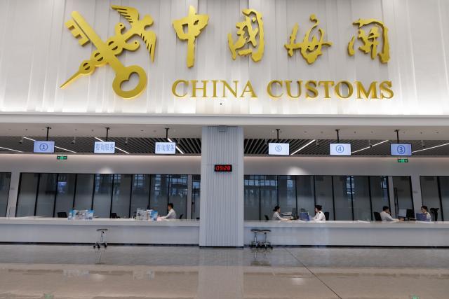 (251212) -- HAIKOU, Dec. 12, 2025 (Xinhua) -- Staff members take part in a procedure rehearsal at a customs clearance center of Xinhai Port and Nangang Port for trucks departing from Hainan in Haikou, south China's Hainan Province, Dec. 10, 2025. The Hainan Free Trade Port is preparing for island-wide special customs operations starting Dec. 18., a major milestone in the opening-up drive of the world's second-largest economy despite rising protectionism worldwide. (Xinhua/Jin Liwang)