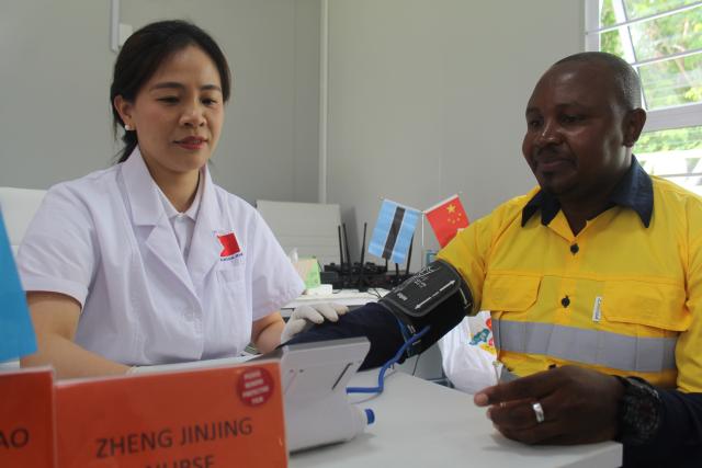 (251212) -- GABORONE, Dec. 12, 2025 (Xinhua) -- Mayor of Francistown Gaone Majere receives medical service during a free medical outreach event in Francistown, Botswana, Dec. 12, 2025. The 17th batch of the Chinese medical team in Botswana on Friday conducted a free medical outreach at an industrial community in Francistown, the country's second largest city. (Photo by Shingirai Madondo/Xinhua)