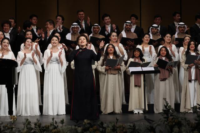 (251212) -- DHAHRAN, Dec. 12, 2025 (Xinhua) -- The China National Center for the Performing Arts (NCPA) Chorus, together with Choralla, a local Saudi choir, stage the World Famous Songs Concert at the King Abdulaziz Center for World Culture, in Dhahran, Saudi Arabia, Dec. 11, 2025. Chinese and Saudi artists performed together on Thursday in a concert that marked the highlight of the NCPA Chorus's first tour in the kingdom. (Xinhua/Wang Haizhou)