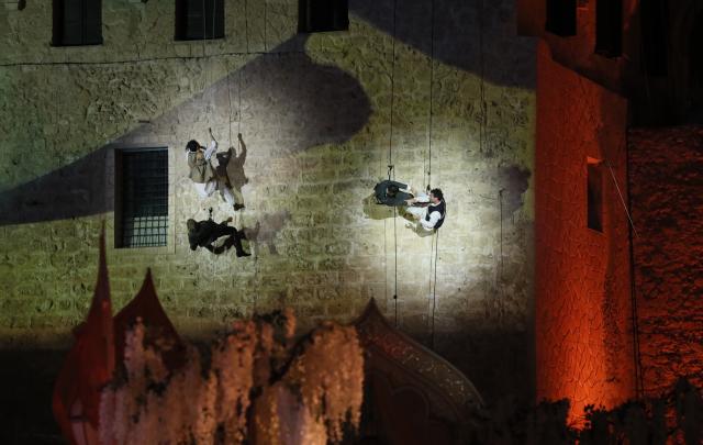 (251212) -- TRIPOLI, Dec. 12, 2025 (Xinhua) -- Artists stage a performance celebrating the reopening of National Museum in Tripoli, Libya, Dec. 12, 2025. Libya on Friday celebrated the reopening of its national museum, housed within the historic Red Castle complex in Tripoli, marking a significant cultural moment after 14 years of closure following the 2011 popular uprising that toppled the rule of Muammar Gaddafi. (Photo by Hazem Turkia/Xinhua)