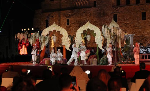 (251212) -- TRIPOLI, Dec. 12, 2025 (Xinhua) -- Artists stage a performance celebrating the reopening of National Museum in Tripoli, Libya, Dec. 12, 2025. Libya on Friday celebrated the reopening of its national museum, housed within the historic Red Castle complex in Tripoli, marking a significant cultural moment after 14 years of closure following the 2011 popular uprising that toppled the rule of Muammar Gaddafi. (Photo by Hazem Turkia/Xinhua)
