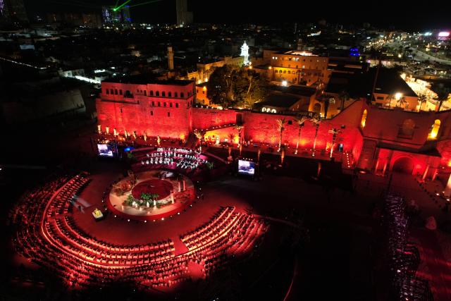 (251212) -- TRIPOLI, Dec. 12, 2025 (Xinhua) -- An aerial drone photo shows a performance celebrating the reopening of National Museum in Tripoli, Libya, Dec. 12, 2025. Libya on Friday celebrated the reopening of its national museum, housed within the historic Red Castle complex in Tripoli, marking a significant cultural moment after 14 years of closure following the 2011 popular uprising that toppled the rule of Muammar Gaddafi. (Photo by Hazem Turkia/Xinhua)